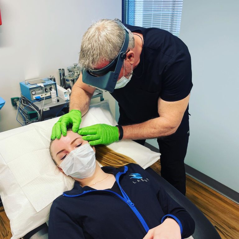 dermatologist performing a skin check