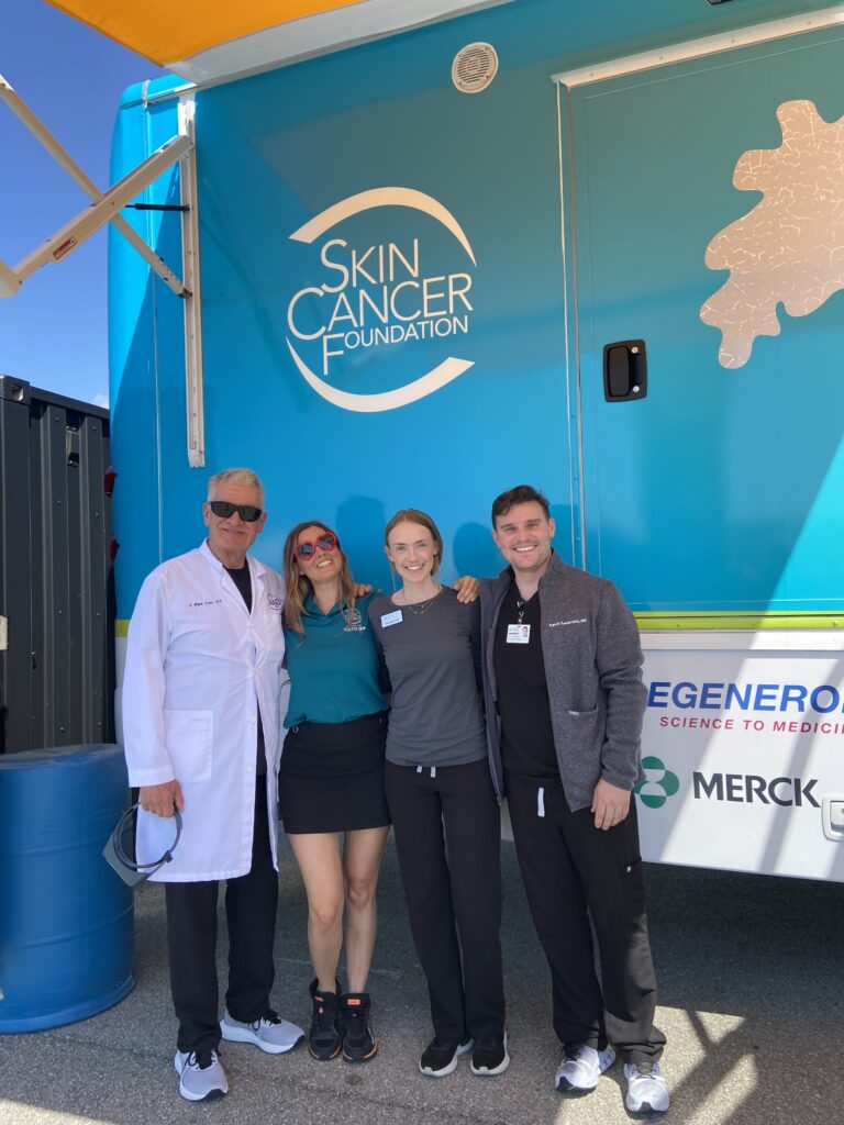 Photo of Dr. Hanke and team at the Destination Healthy Skin event with the Indianapolis Colts and Skin Cancer Foundation